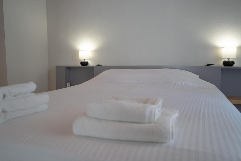 Postel nebo postele na pokoji v ubytování Casanova94 Guesthouse
