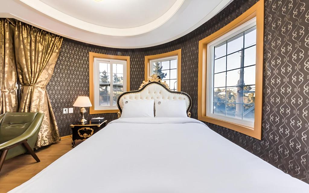 Postel nebo postele na pokoji v ubytování Lamer Hotel