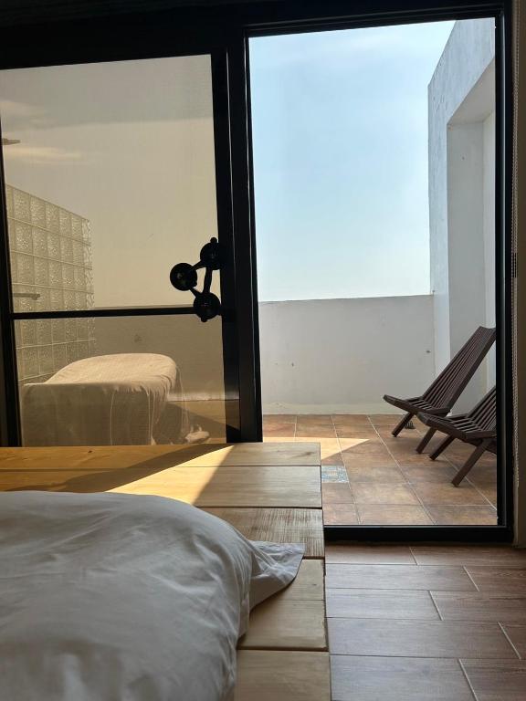 Postel nebo postele na pokoji v ubytování 白沙35 kenting Baisha 35