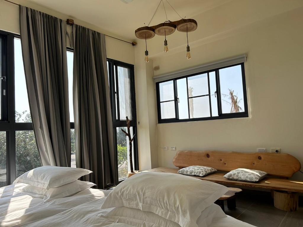 Postel nebo postele na pokoji v ubytování 白沙35 kenting Baisha 35
