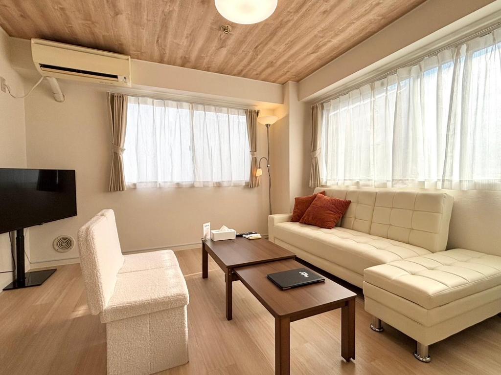 TV a/nebo společenská místnost v ubytování Neighbor's Hotel 十日市