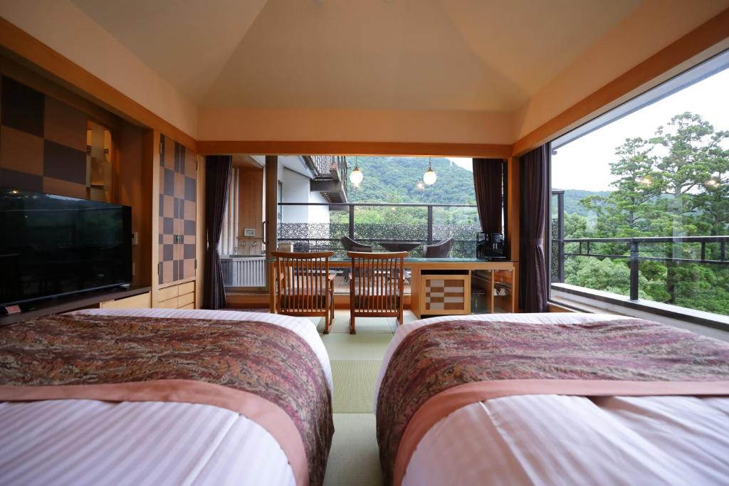 Postel nebo postele na pokoji v ubytování Hakone Kamon