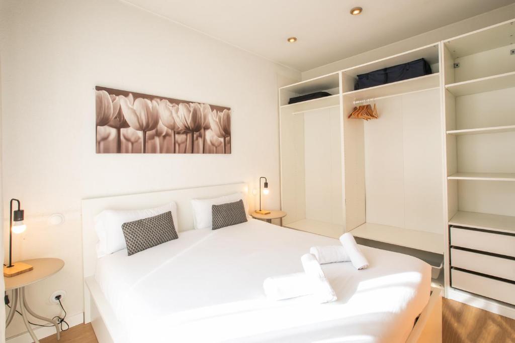 Posteľ alebo postele v izbe v ubytovaní 42ara1026 - Spacious apartment in Eixample