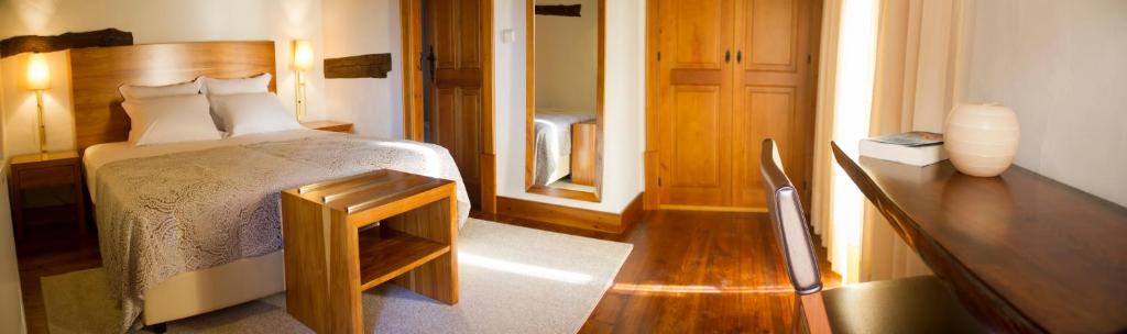 Uma cama ou camas num quarto em Refgios do Pinhal
