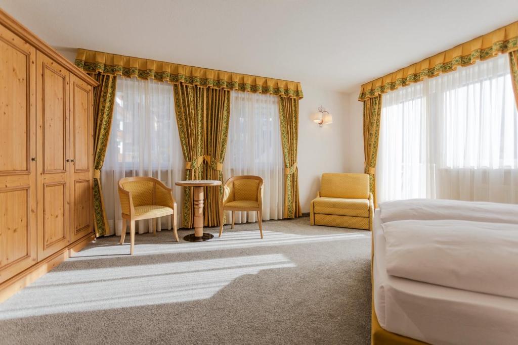 Postel nebo postele na pokoji v ubytování Hotel Maria
