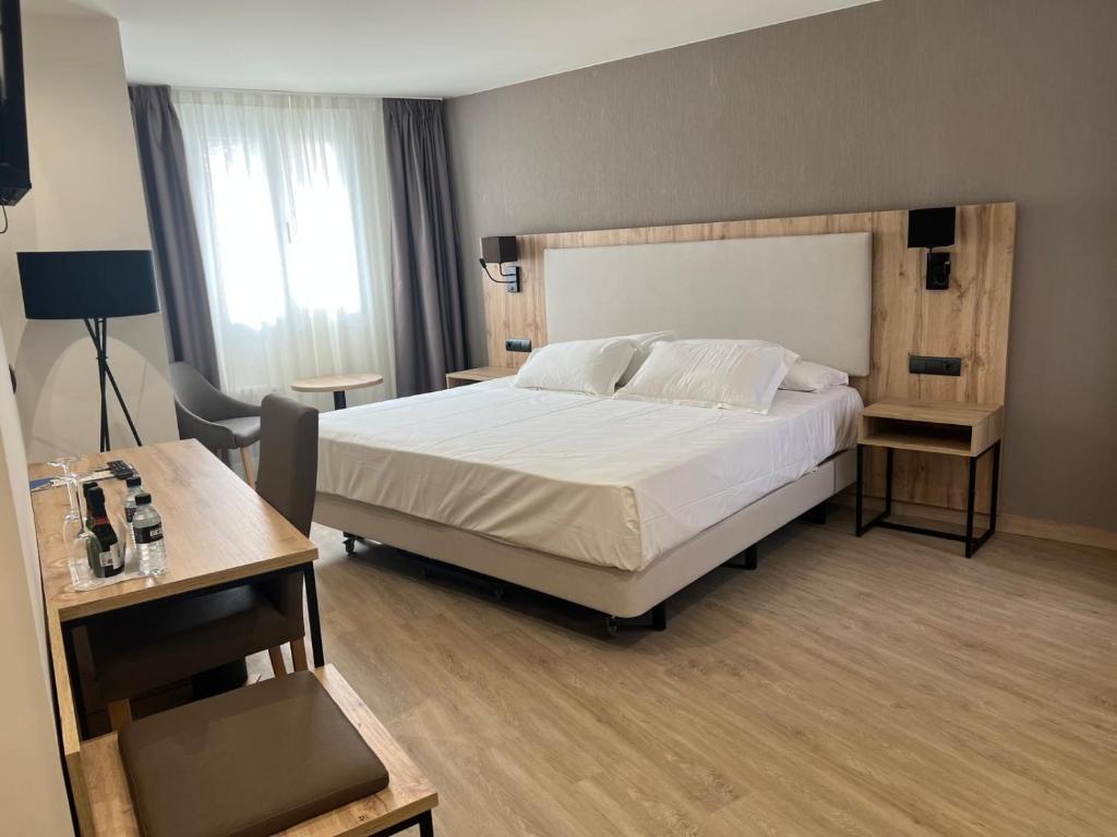 Postel nebo postele na pokoji v ubytování Hotel ELE Acueducto