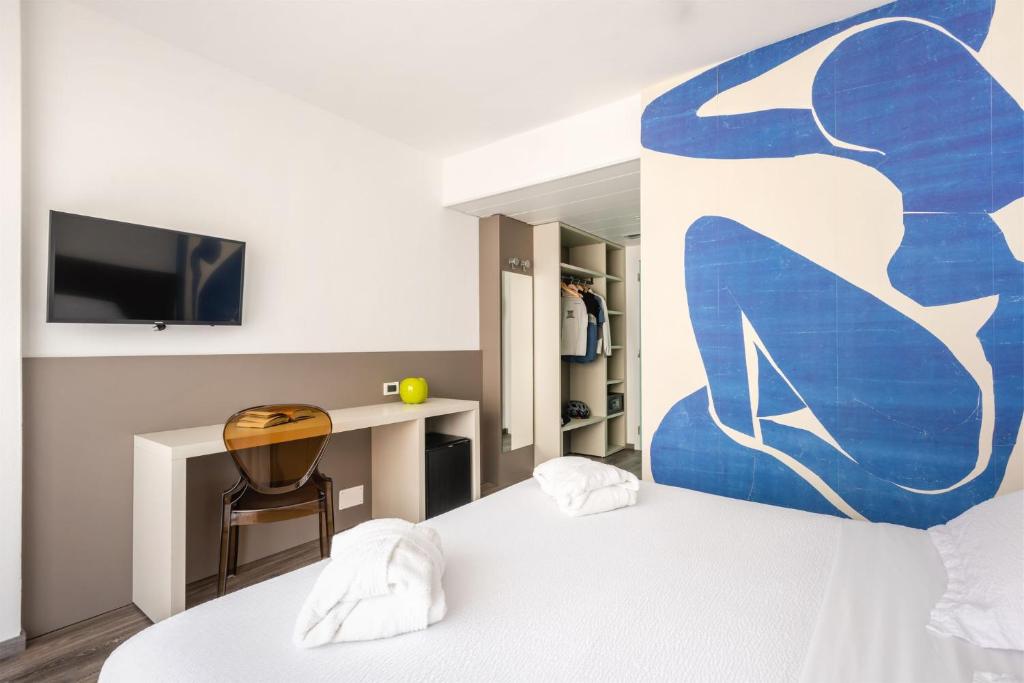Postel nebo postele na pokoji v ubytování Hotel Gabry