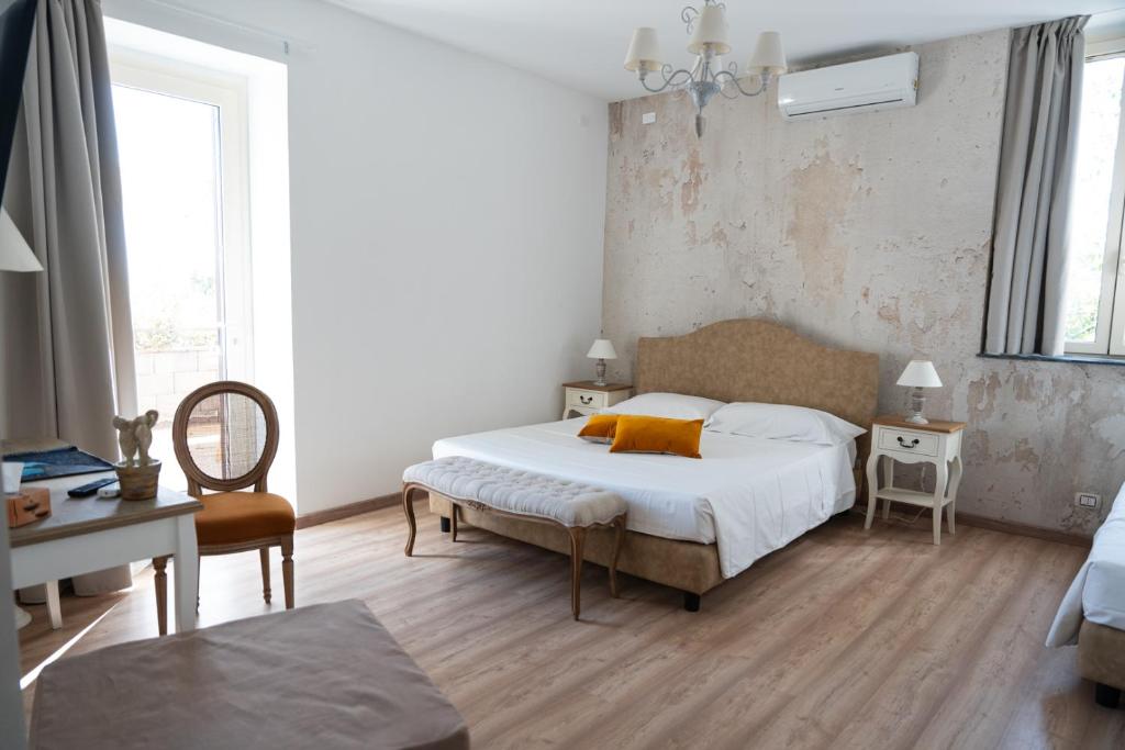 Posteľ alebo postele v izbe v ubytovaní B&B Donna Cinzia