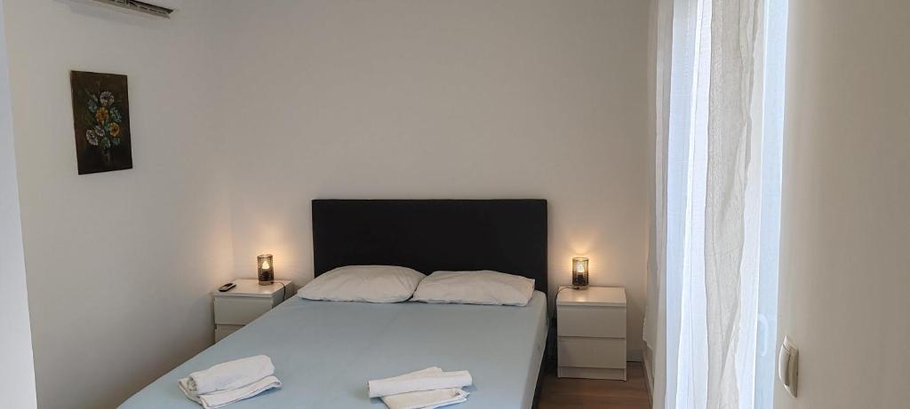 Postel nebo postele na pokoji v ubytování Guest House Pikala