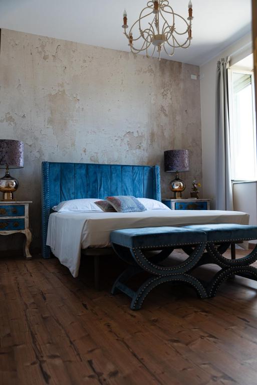 Posteľ alebo postele v izbe v ubytovaní B&B Donna Cinzia