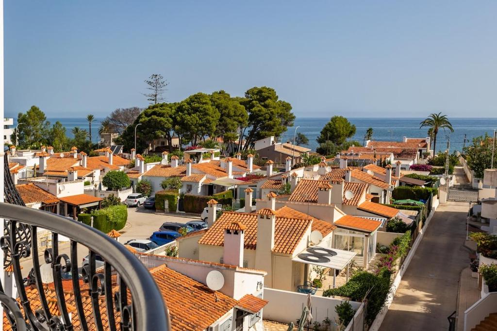 a view from a balcony of a town with houses at Seaside Serenity in Denia in Denia