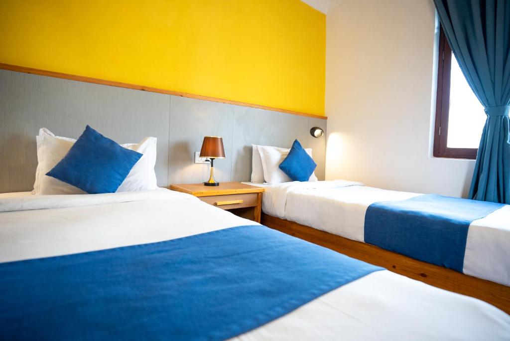 Krevet ili kreveti u jedinici u okviru objekta Gaurishankar Backpackers hostel