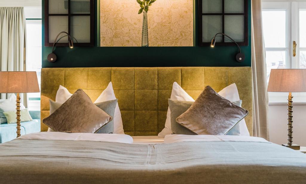 Postel nebo postele na pokoji v ubytování Hotel Brandauers Villen Superior