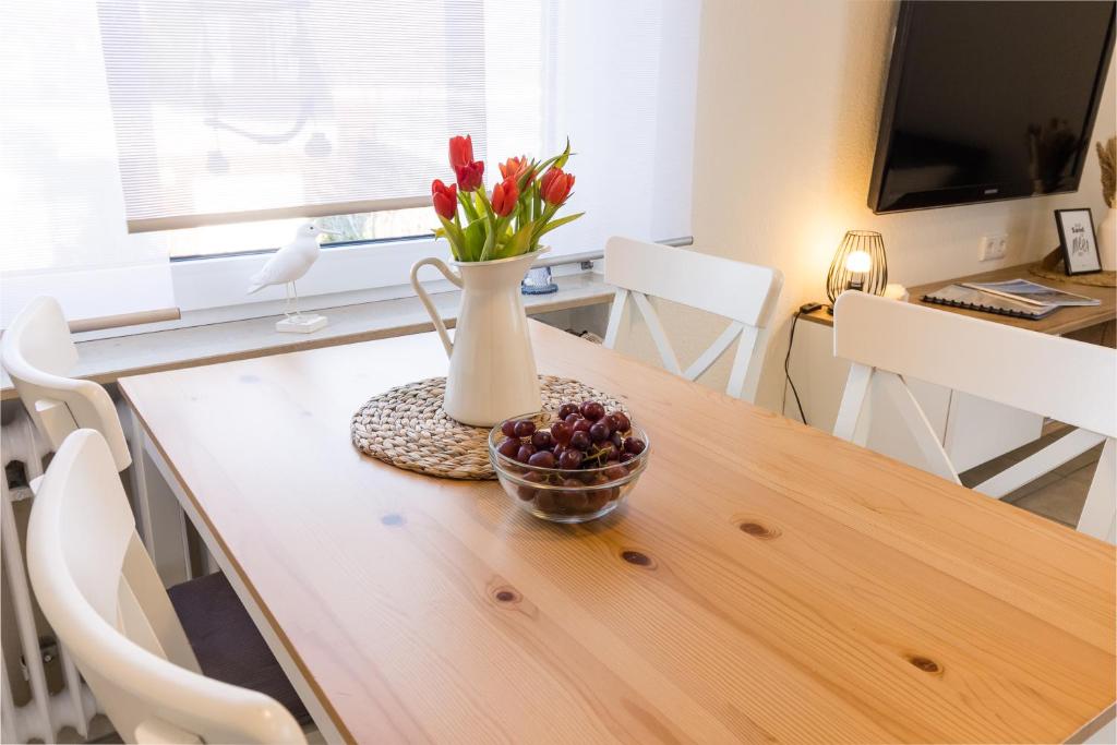 TV a/nebo společenská místnost v ubytování Ferienwohnung Strandkiste
