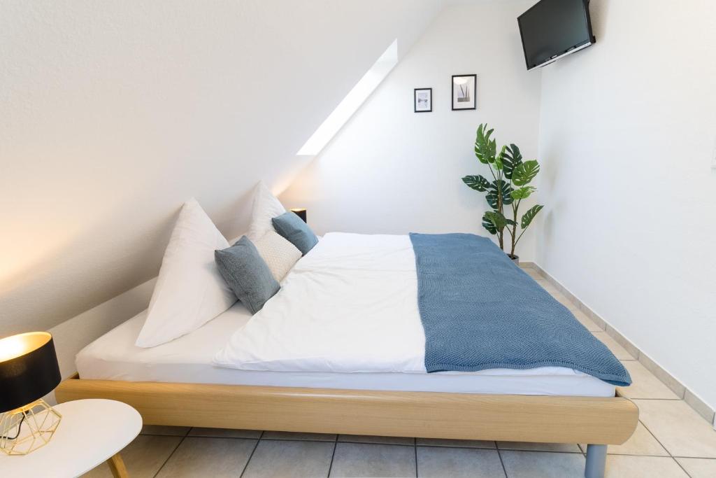 Postel nebo postele na pokoji v ubytování Ferienwohnung Strandkiste