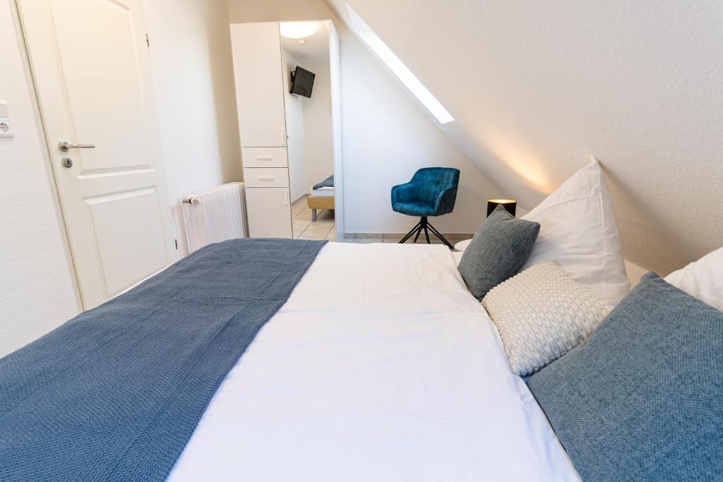 Postel nebo postele na pokoji v ubytování Ferienwohnung Strandkiste
