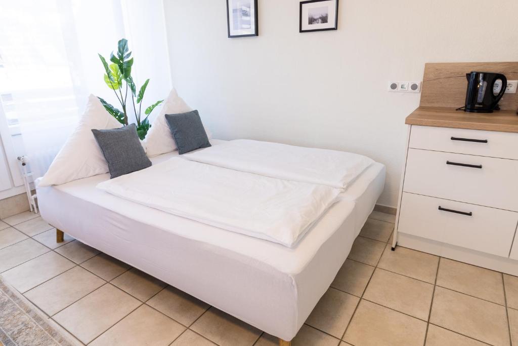 Postel nebo postele na pokoji v ubytování Ferienwohnung Strandkiste