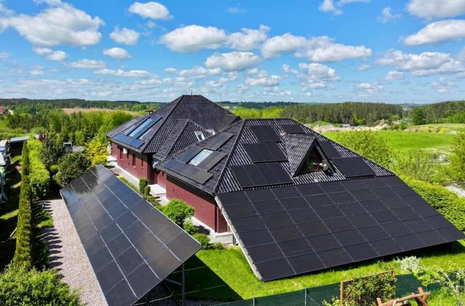 an overhead view of a house with solar panels on the roof at Premium Residence SPA & Garden in Glińcz
