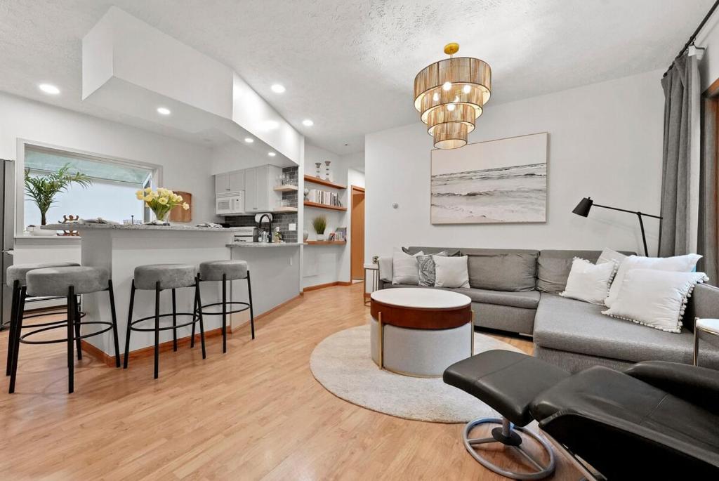 a living room with a couch and a table at Hidden Haven in Traverse City
