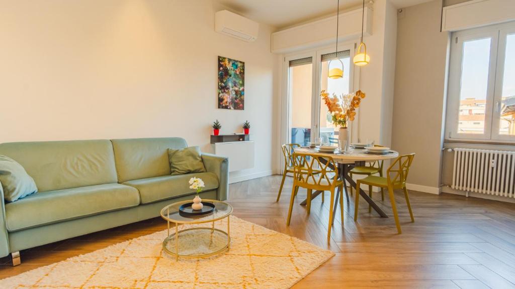 a living room with a couch and a table at The Roman Villa View - Italian Homing in Desenzano del Garda