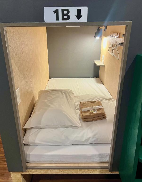 Postel nebo postele na pokoji v ubytování Yoroi Asakusa Hotel