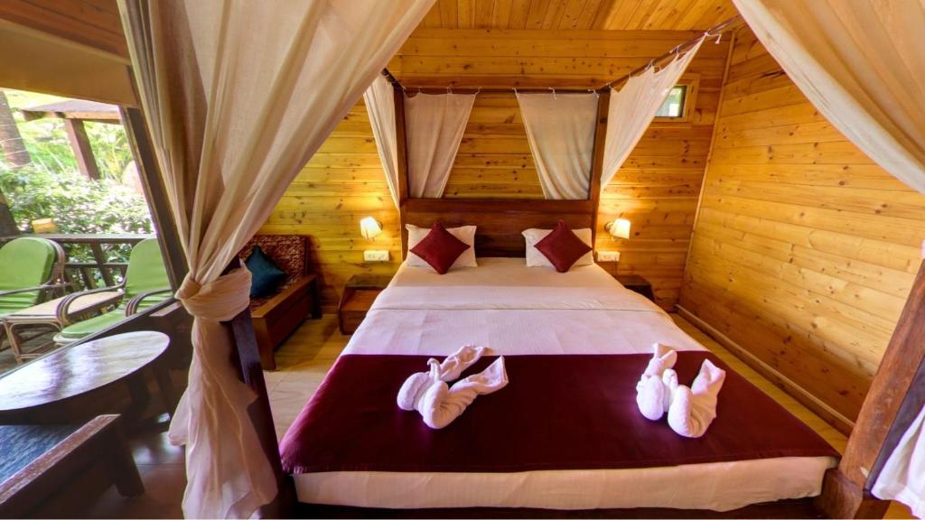 Postel nebo postele na pokoji v ubytování Golden Sands Resort, Morjim