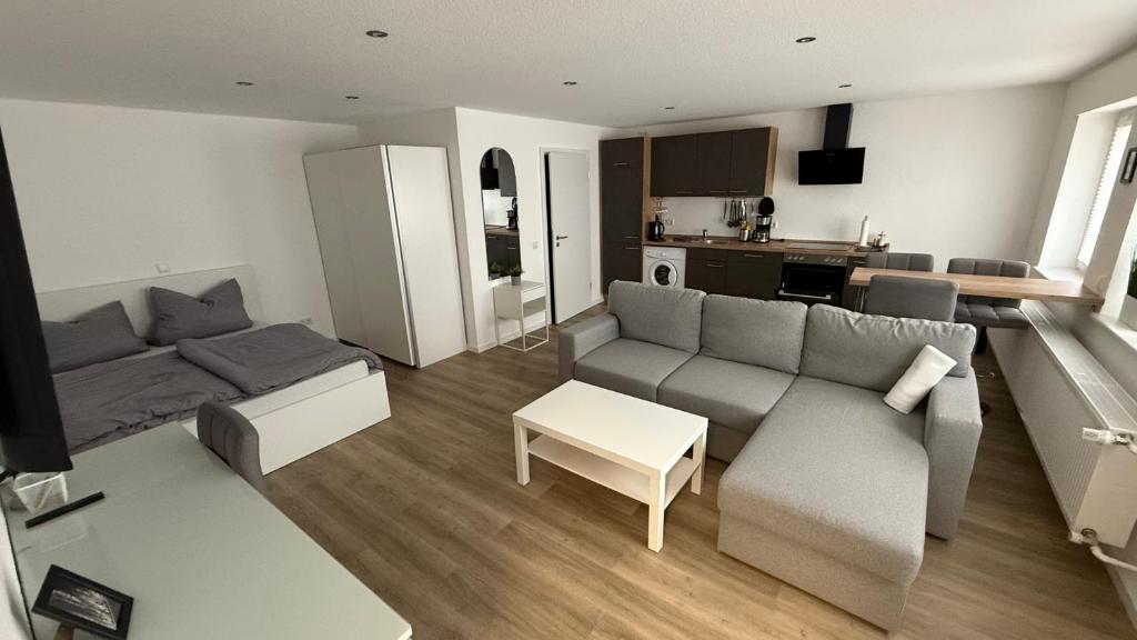 a living room with a couch and a table at 36qm Wohnung für bis zu 4 Pers in Hungen