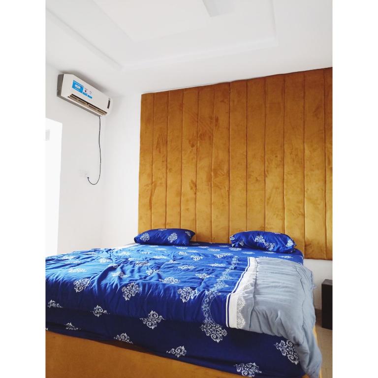 Postel nebo postele na pokoji v ubytování Jeymax Hotel and Suite