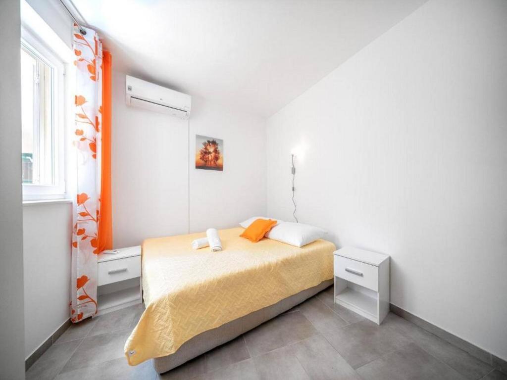 Postel nebo postele na pokoji v ubytování Apartments Matija