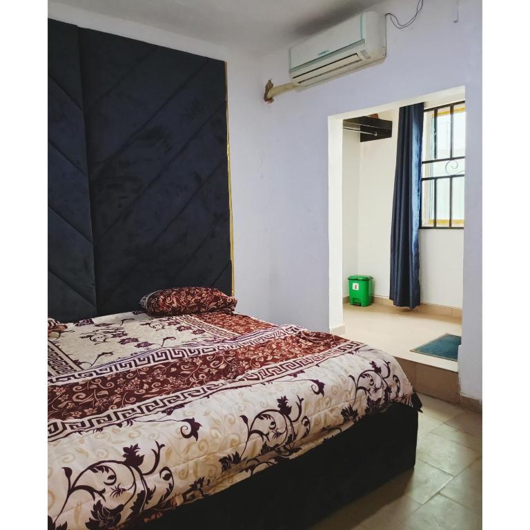 Postel nebo postele na pokoji v ubytování Jeymax Hotel and Suite