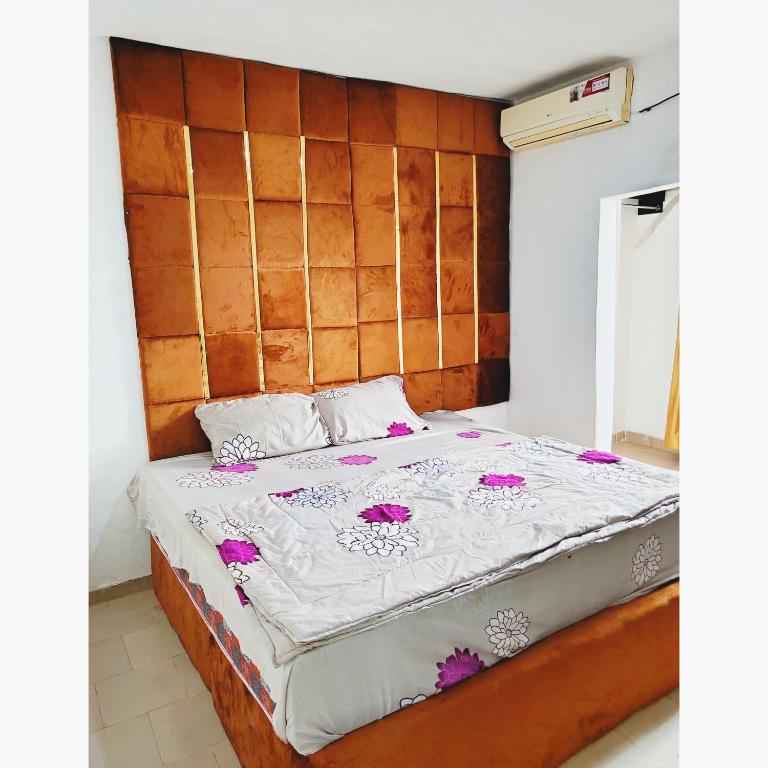 Postel nebo postele na pokoji v ubytování Jeymax Hotel and Suite