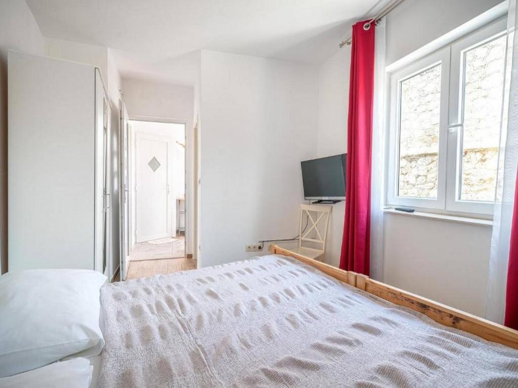Postel nebo postele na pokoji v ubytování Apartments Matija
