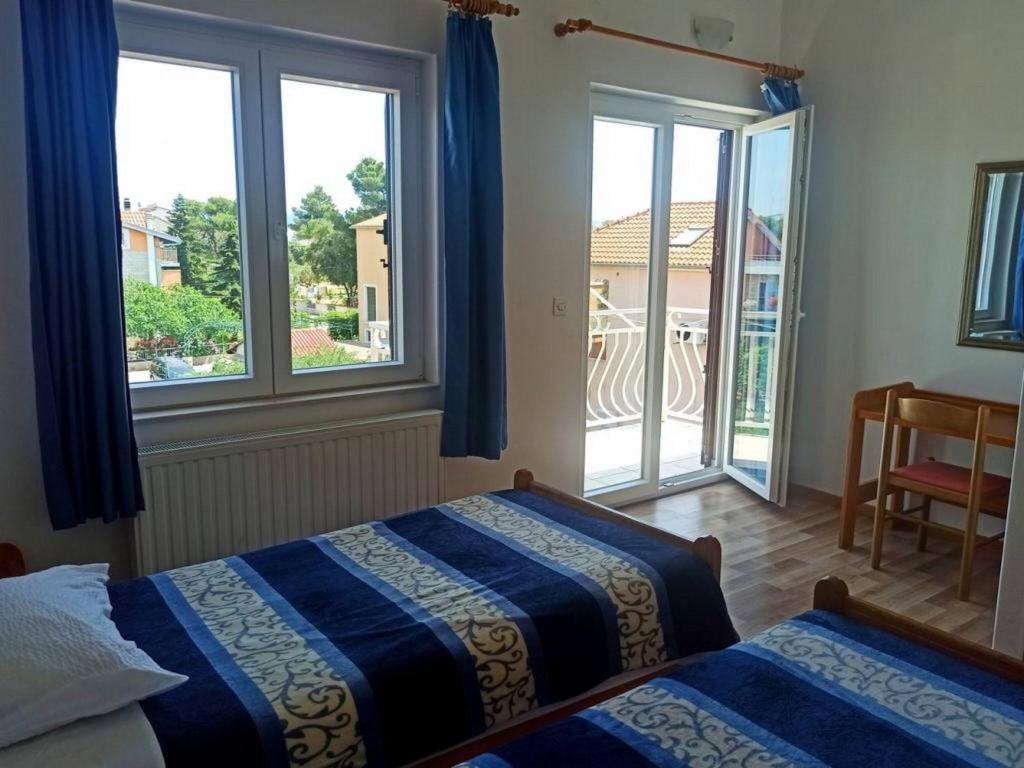 Postel nebo postele na pokoji v ubytování Apartments Pletikosa Gaj