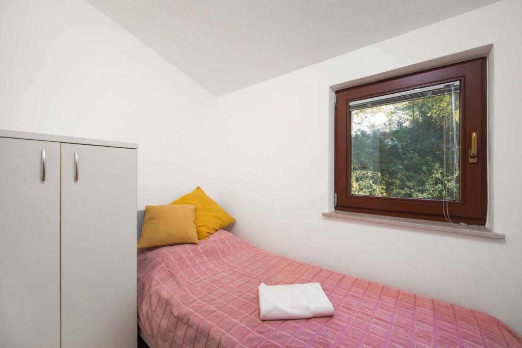 Postel nebo postele na pokoji v ubytování Apartments Kaina