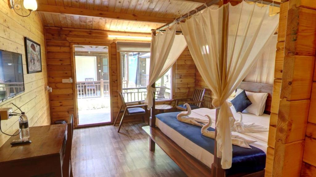 Postel nebo postele na pokoji v ubytování Golden Sands Resort, Morjim