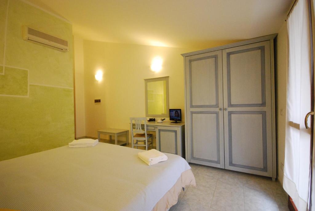 Postel nebo postele na pokoji v ubytování Hotel Jasmine