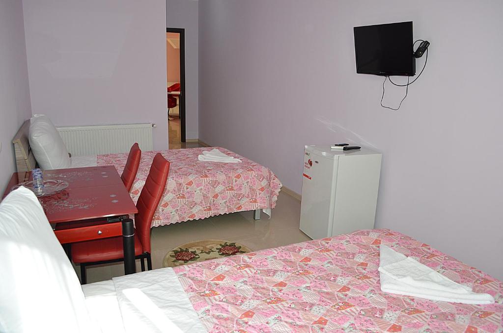 Postel nebo postele na pokoji v ubytování Hotel Okriba
