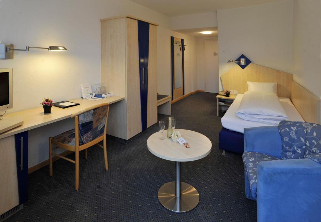 Postel nebo postele na pokoji v ubytování Hotel Blumenstein Self-Check In