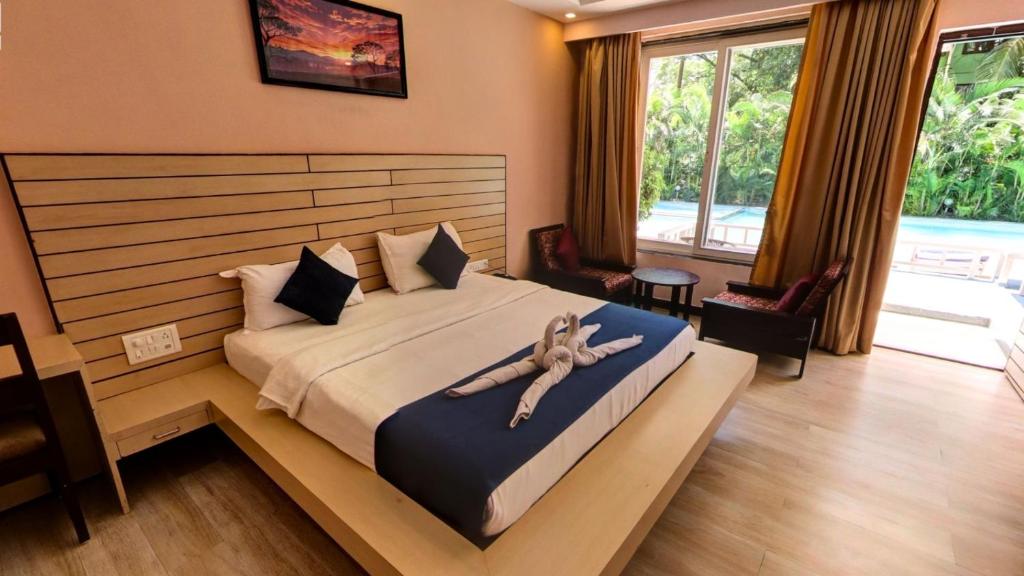 Postel nebo postele na pokoji v ubytování Golden Sands Resort, Morjim