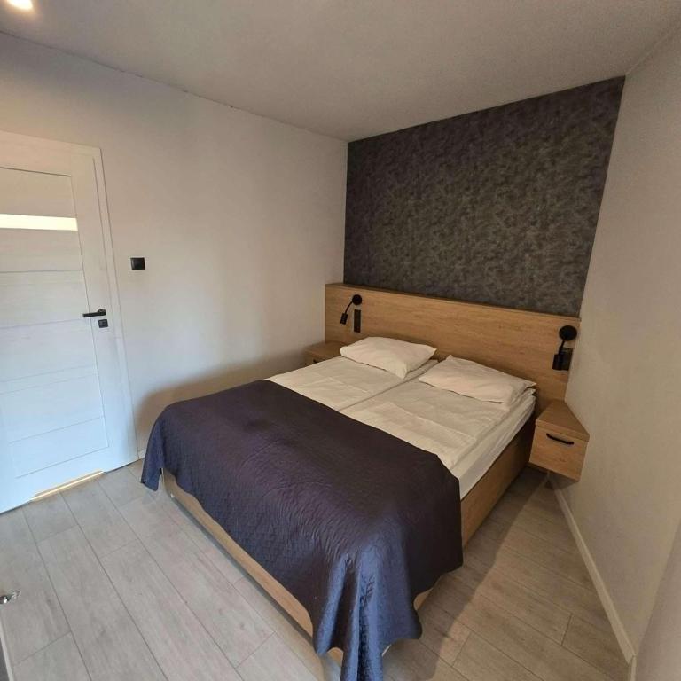 Posteľ alebo postele v izbe v ubytovaní Apartamenty nad Wisłą