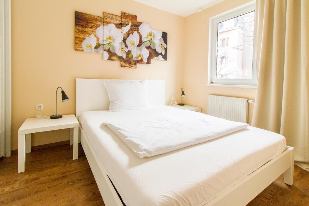 Posteľ alebo postele v izbe v ubytovaní Residenz Donaucity