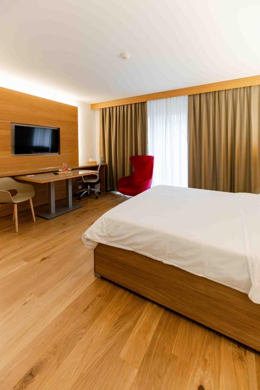 Postel nebo postele na pokoji v ubytování Los Lorentes Apartments Bern City