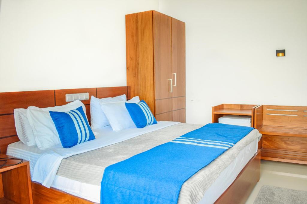 Postel nebo postele na pokoji v ubytování Flaming Tree Resorts