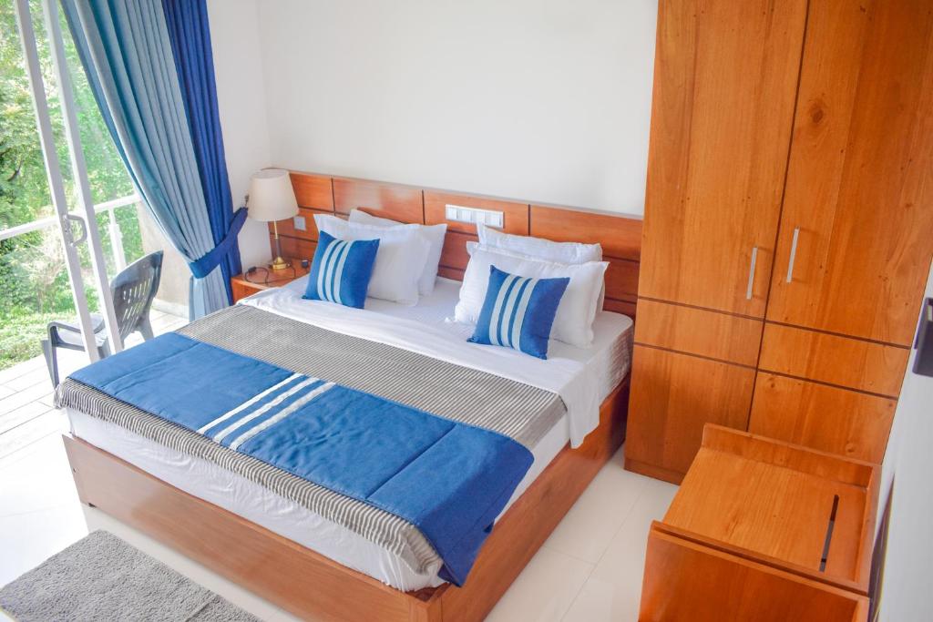 Postel nebo postele na pokoji v ubytování Flaming Tree Resorts