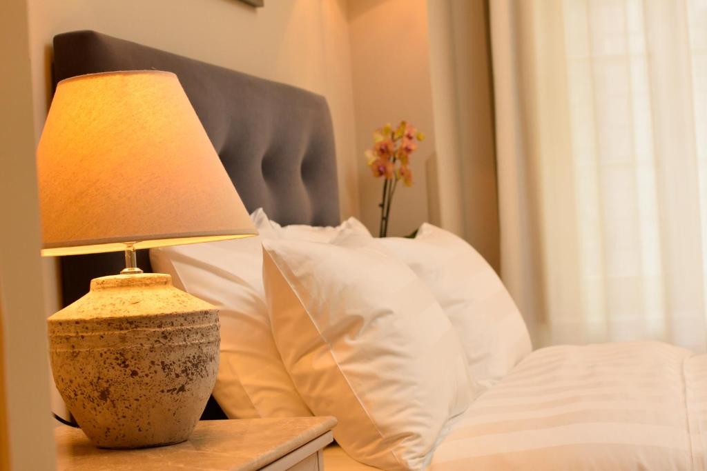 Posteľ alebo postele v izbe v ubytovaní Hotel Antique
