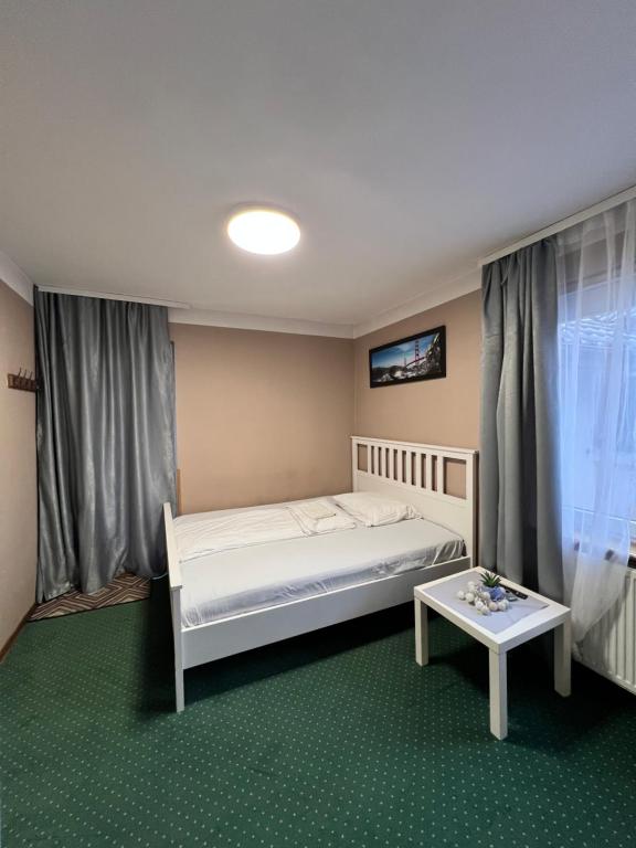 Postel nebo postele na pokoji v ubytování Noclegi AirportPark