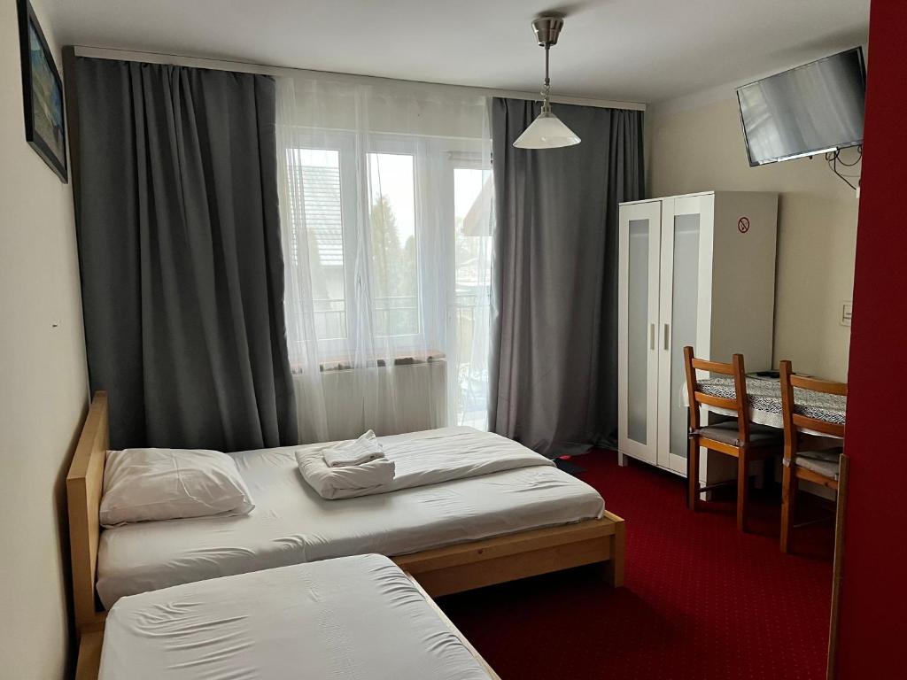 Postel nebo postele na pokoji v ubytování Noclegi AirportPark