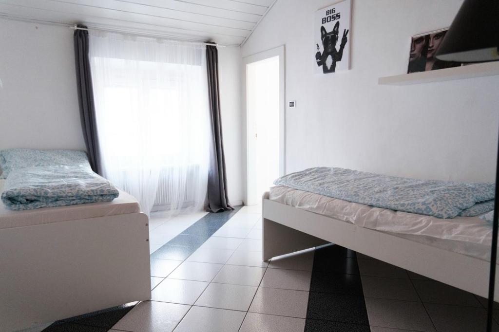Postel nebo postele na pokoji v ubytování Druso Rooms
