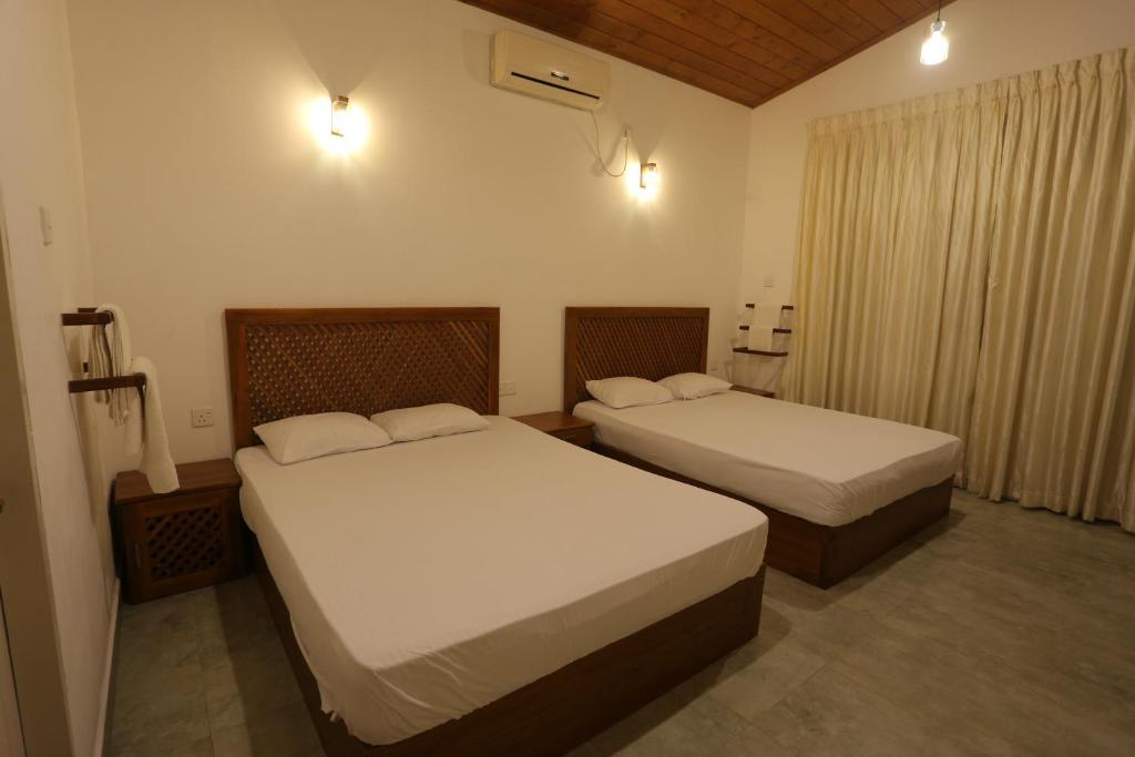 Postel nebo postele na pokoji v ubytování Serenity Villa Anuradhapura