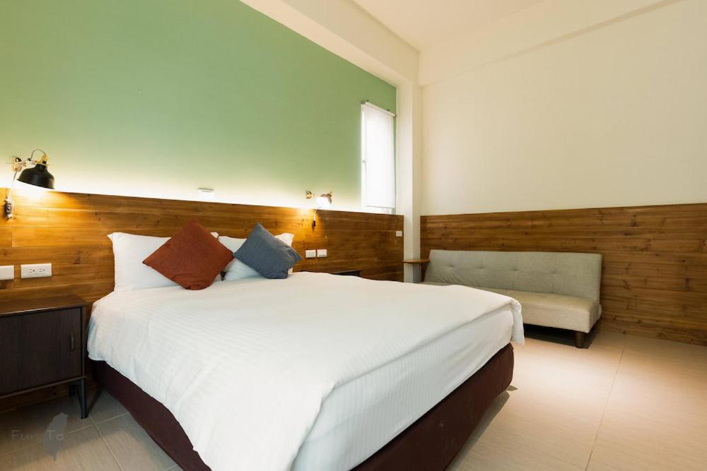 Postel nebo postele na pokoji v ubytování 沉靛旅宿 La Casa Indaco 墾丁夢幻島Villa